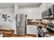 Contemporary kitchen with stainless steel appliances, light wood floors and subway tile backsplash at 400 17Th Nw St # 1315, Atlanta, GA 30363