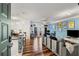 Bright open-concept living area with hardwood floors, modern decor, and bar seating at 400 17Th Nw St # 1315, Atlanta, GA 30363