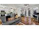 Open-concept living area with hardwood floors, kitchen, dining, and access to a balcony at 400 17Th Nw St # 1315, Atlanta, GA 30363