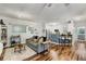 Open-concept living space with a modern kitchen, comfortable seating, and hardwood floors at 400 17Th Nw St # 1315, Atlanta, GA 30363