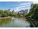 Serene community pond with manicured greenery, bridge and city views at 400 17Th Nw St # 1315, Atlanta, GA 30363