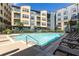 Community swimming pool surrounded by sundeck with lounge chairs at an apartment complex at 400 17Th Nw St # 1315, Atlanta, GA 30363
