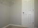 A walk-in closet has a top shelf and hanging rod for storage, providing an organized space at 4018 Woodridge Way, Tucker, GA 30084