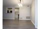 Open floor plan from the living room view to the kitchen featuring white cabinets at 4018 Woodridge Way, Tucker, GA 30084