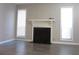 The living room features a fireplace and a large window for ample natural light at 4018 Woodridge Way, Tucker, GA 30084