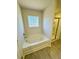 Bathroom with garden tub, separate shower and tiled floor at 4685 Trefoil Path, Cumming, GA 30040