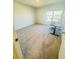 Bright bedroom featuring carpeted flooring, a desk, and window at 4685 Trefoil Path, Cumming, GA 30040