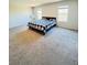 Primary bedroom with large windows and carpet floors at 4685 Trefoil Path, Cumming, GA 30040