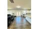 Open concept kitchen with stainless appliances, lots of light and wood floors at 4685 Trefoil Path, Cumming, GA 30040