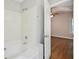 This bathroom features a tub, a shower and is located just off the bedroom at 5126 Farm Place Ne Dr, Woodstock, GA 30188