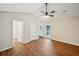 Bedroom featuring a vaulted ceiling, fan, and multiple doors and windows for natural light at 5126 Farm Place Ne Dr, Woodstock, GA 30188