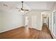 Spacious bedroom showcasing the wood-look floors, vaulted ceiling and attached bath at 5126 Farm Place Ne Dr, Woodstock, GA 30188
