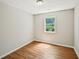 Clean bedroom boasts ample sunlight and new floors at 5126 Farm Place Ne Dr, Woodstock, GA 30188
