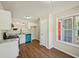 Updated kitchen with white cabinets, granite countertops, subway tile backsplash, and stainless appliances at 5126 Farm Place Ne Dr, Woodstock, GA 30188