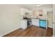 Bright kitchen with white cabinets, stainless steel appliances, and modern subway tile backsplash at 5126 Farm Place Ne Dr, Woodstock, GA 30188