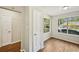 Bright living room features hardwood floors, natural light and neutral paint tones at 5126 Farm Place Ne Dr, Woodstock, GA 30188