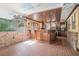 Unique bar area with detailed wood trim, faux brickwork, and a decorative tin tile ceiling at 1751 Bergen Ct, Lawrenceville, GA 30043