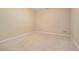 Neutral bedroom with cream colored carpet, white trim, and multiple electrical outlets at 1751 Bergen Ct, Lawrenceville, GA 30043