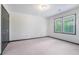 Bedroom with neutral carpet, a double window allowing ample natural light, and stylish baseboard trim at 1751 Bergen Ct, Lawrenceville, GA 30043