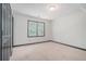 Bedroom with neutral carpet, a double window allowing ample natural light, and stylish baseboard trim at 1751 Bergen Ct, Lawrenceville, GA 30043