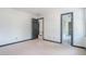 Bright bedroom features neutral carpet, white walls, and stylish dark trim around the doors and baseboards at 1751 Bergen Ct, Lawrenceville, GA 30043