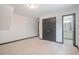 Bedroom with neutral carpet, closet, and doorways leading to other rooms in the home at 1751 Bergen Ct, Lawrenceville, GA 30043