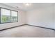Clean bedroom with natural light, white carpet, and neutral paint at 1751 Bergen Ct, Lawrenceville, GA 30043