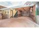 Grand bonus room with wood paneled walls, brick accents, and muraled ceilings offers a unique and spacious entertaining area at 1751 Bergen Ct, Lawrenceville, GA 30043