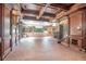 Grand bonus room with wood paneled walls, brick accents, and muraled ceilings offers a unique and spacious entertaining area at 1751 Bergen Ct, Lawrenceville, GA 30043
