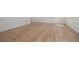 Bright room featuring natural hardwood floors with white trim and baseboards at 1751 Bergen Ct, Lawrenceville, GA 30043
