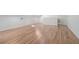 Bright room featuring natural hardwood floors with white trim and baseboards at 1751 Bergen Ct, Lawrenceville, GA 30043