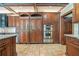 Kitchen with custom cabinets and stainless appliances including refrigerator and double ovens at 1751 Bergen Ct, Lawrenceville, GA 30043