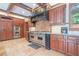 Gourmet kitchen features professional-grade stainless steel appliances, custom hood, and granite countertops at 1751 Bergen Ct, Lawrenceville, GA 30043
