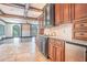 Gourmet kitchen featuring custom cabinetry, granite countertops, tile floors and stainless steel appliances at 1751 Bergen Ct, Lawrenceville, GA 30043