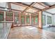 Bright kitchen featuring custom cabinets, granite countertops, a chandelier, and access to an outdoor deck at 1751 Bergen Ct, Lawrenceville, GA 30043