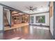 Open-concept living space featuring hardwood floors and seamless flow into a chef's kitchen with coffered ceilings at 1751 Bergen Ct, Lawrenceville, GA 30043