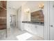 Beautiful main bathroom featuring double sink vanity, marble floors, and glass shower at 1751 Bergen Ct, Lawrenceville, GA 30043