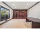 Home office with custom built-in shelving and a large window at 1751 Bergen Ct, Lawrenceville, GA 30043