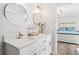 Bathroom showcasing a double sink vanity with modern fixtures and mirrors at 41 Jessica Ln, Dallas, GA 30157