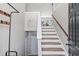 Inviting entryway with staircase, coat rack, and 'Welcome' sign, leading into a bright, open living space at 41 Jessica Ln, Dallas, GA 30157