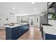 Spacious kitchen with a central island, stainless steel appliances, and modern finishes, flowing into dining area at 41 Jessica Ln, Dallas, GA 30157