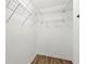 White walk-in closet includes white wire shelving and light-colored wood flooring at 41 Jessica Ln, Dallas, GA 30157
