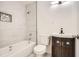 Updated bathroom with a shower-tub combo, marble tiling, and a modern vanity at 4201 Regal Ridge Rd, Austell, GA 30106