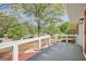 Relaxing front porch with white railing, overlooking the beautifully landscaped front yard at 4201 Regal Ridge Rd, Austell, GA 30106