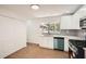 Bright kitchen featuring white cabinets, stainless steel appliances, and a stylish backsplash at 4201 Regal Ridge Rd, Austell, GA 30106