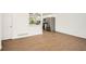 Open-concept living area with wood floors leading into a renovated kitchen at 4201 Regal Ridge Rd, Austell, GA 30106