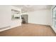 Open-concept living space with modern floors connecting the living and kitchen areas at 4201 Regal Ridge Rd, Austell, GA 30106