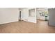 Bright open-concept living space with sleek floors, adjacent to an updated kitchen at 4201 Regal Ridge Rd, Austell, GA 30106