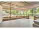 Covered back patio with brick accents, offering a shaded outdoor living space at 4201 Regal Ridge Rd, Austell, GA 30106