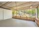 Relaxing outdoor space featuring a covered patio with brick and open views of backyard at 4201 Regal Ridge Rd, Austell, GA 30106